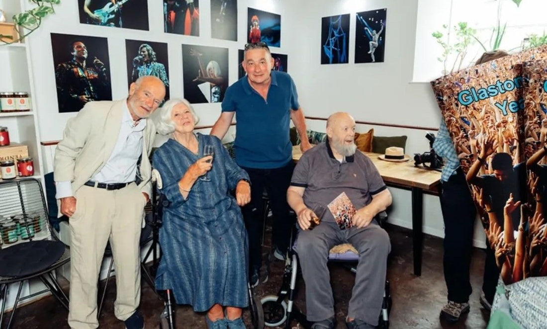 Ann Cook with Michael Eavis and guests at her Glastonbury Years photography exhibition at The Pressoir in Wells
